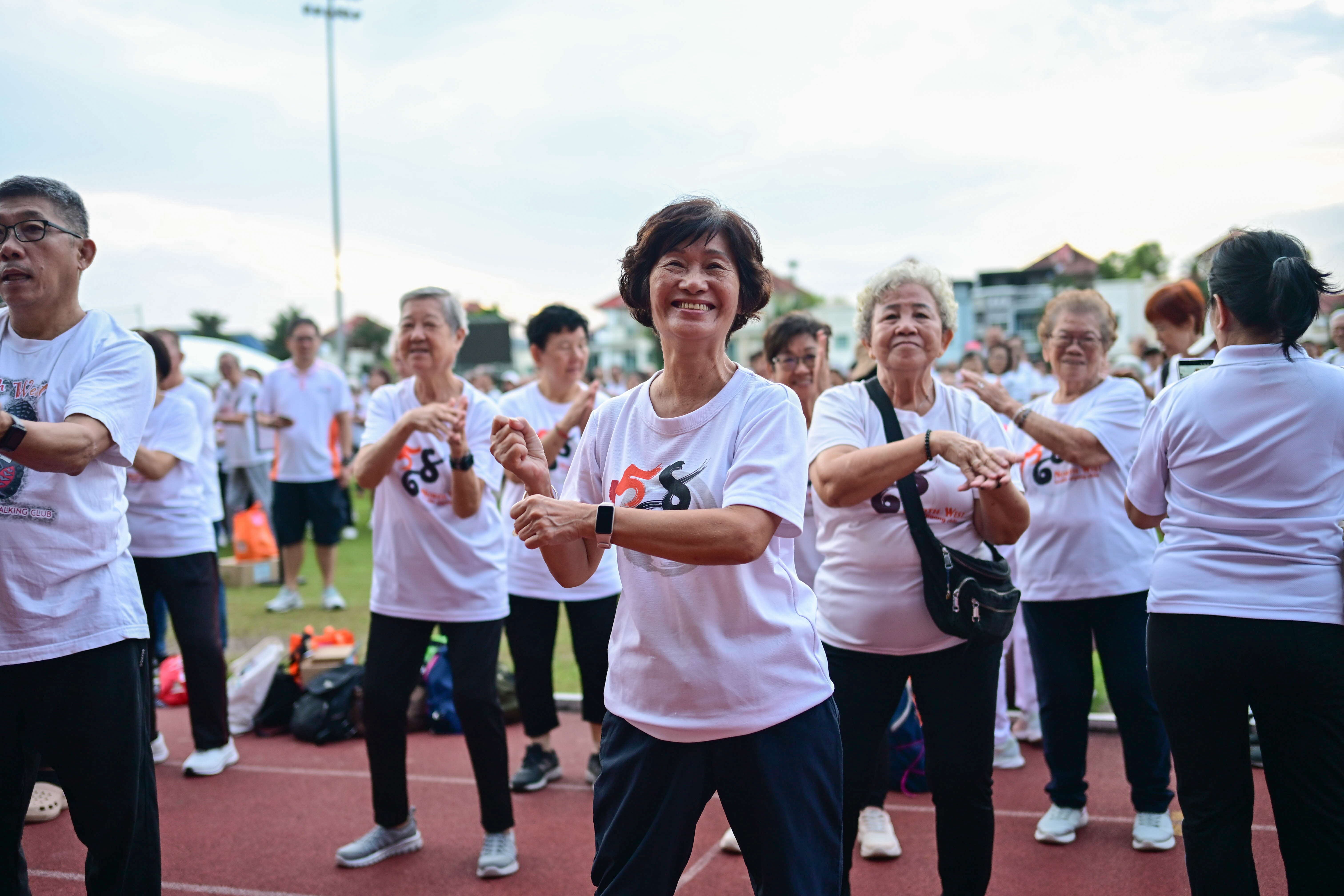 North West Health Qigong Club member doing warm up exercises